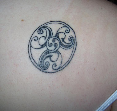 Circle black tracery tattoo