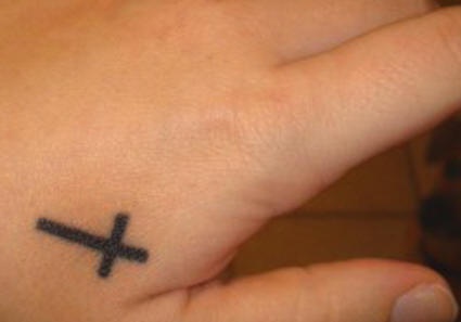 Small latin cross tattoo