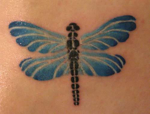 Small blue and black dragonfly tattoo