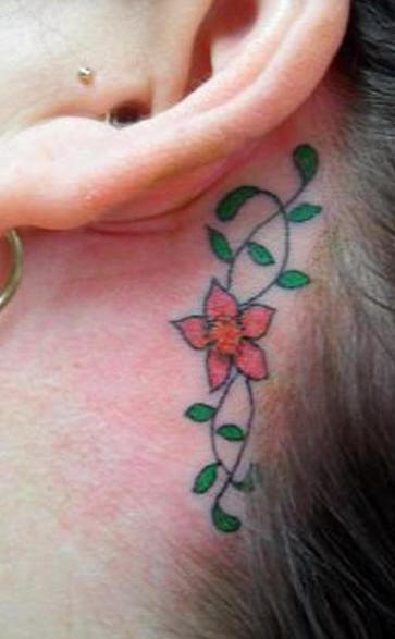 Coloured flower tracery tattoo behind ear