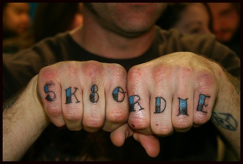 Sk8 or die, styled  inscription  small hand tattoo