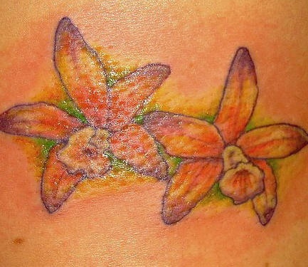 Small yellow orchid tattoo