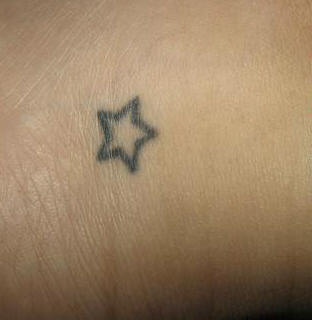 Tiny simple star tattoo
