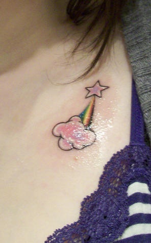 Small star and rainbow tattoo