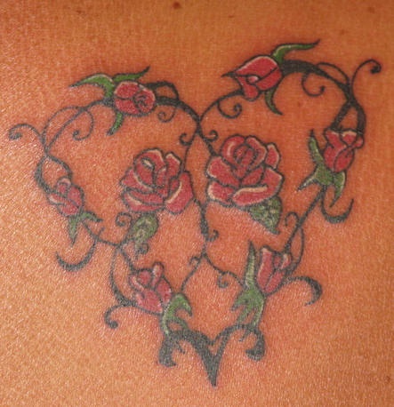 Red rose heart tracery tattoo