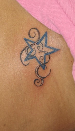 Blue star with tracery tattoo