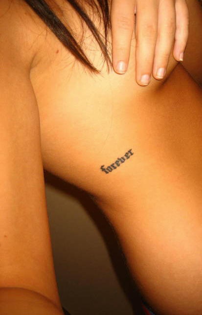 Small forever writing tattoo on side
