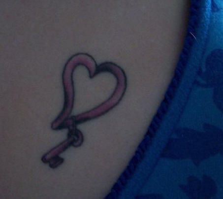 Heart symbol with key tattoo