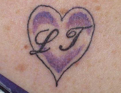 Initials in heart lovers tattoo