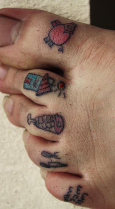 Small primitive toe tattoos