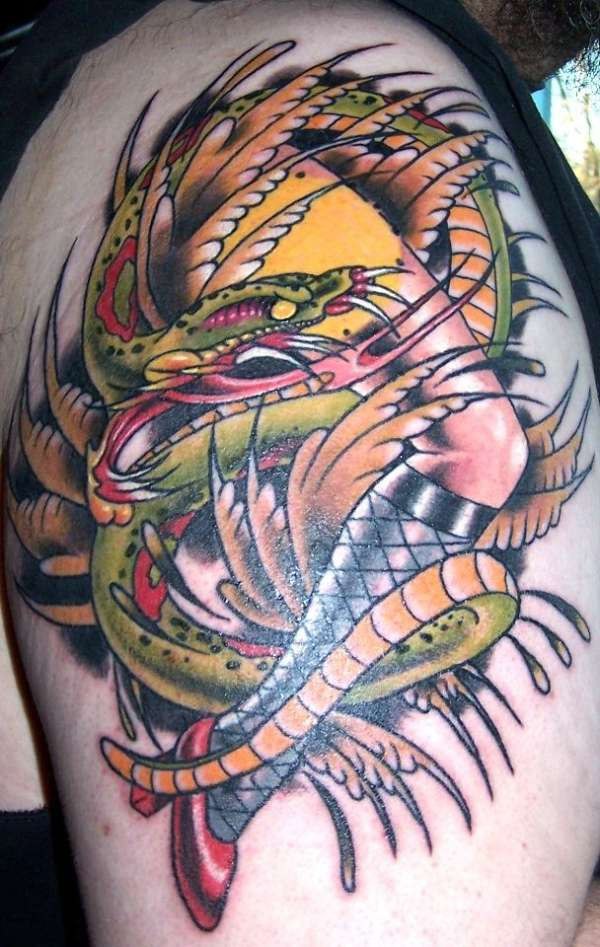 Pinup girl leg and snake tattoo