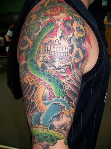 Sugar skull with snake and eagle tattoo