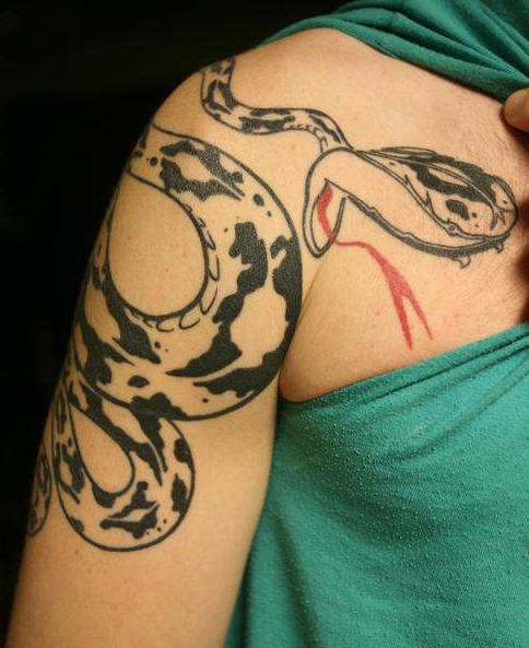 Black ink snake tattoo on shoulder