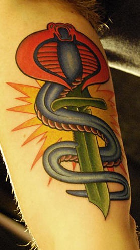 Snake and dagger symbol tattoo