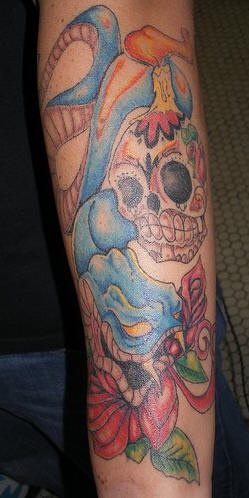 Sugar skull and blue snake tattoo