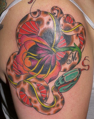 Snake abd flower coloured shoulder tattoo