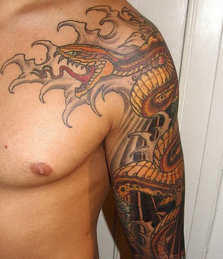Asian style snake and sea tattoo