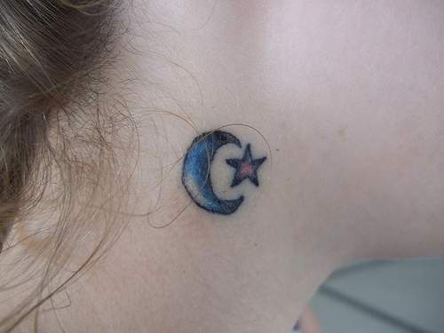 Star and crescent tattoo on neck