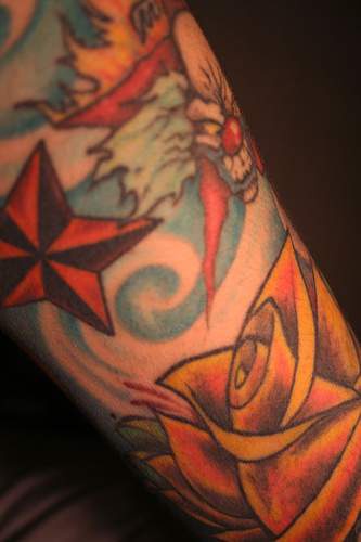 Star and evil clown  tattoo