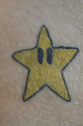 Yellow star from mario tattoo