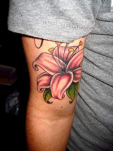Elegant pink lily tattoo