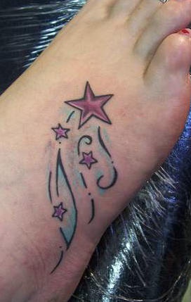Pink shooting stars tattoo on foot