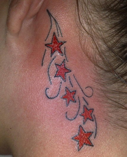 Stars tracery tattoo behind ear