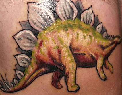 Stegosaurus dinosaur realistic coloured tattoo
