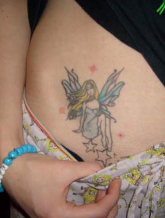 Stomach tattoo, pretty fairy sitting  on stars