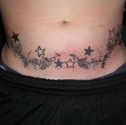 Stomach tattoo, plant with many leaves and stars