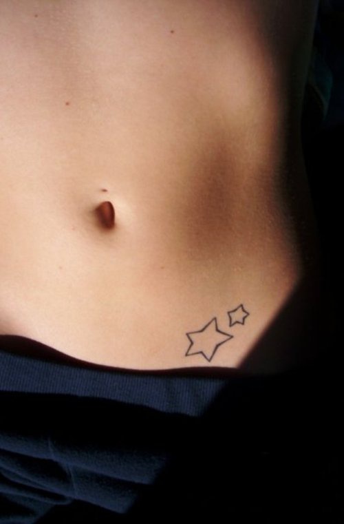 Stomach tattoo, two tiny unfilled stars