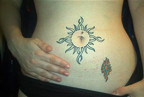 Stomach tattoo, unfilled sun with waving beams