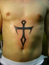 Stomach tattoo, designed, black, sharp cross