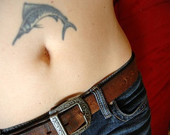 Stomach tattoo, fish with thin sharp nose