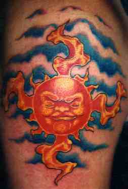 Evil sun in clouds tattoo