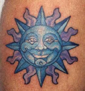 Blue humanized sun tattoo
