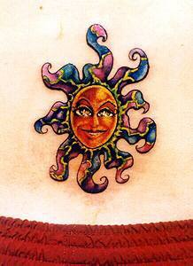 Surreal coloured humanized sun tattoo