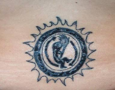 Black ink tribal sun tattoo