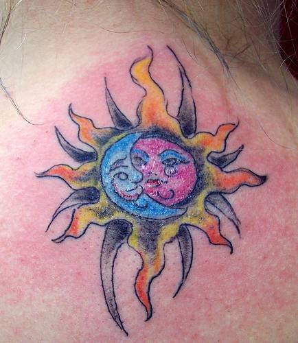 Sun and moon symbol tattoo in colour