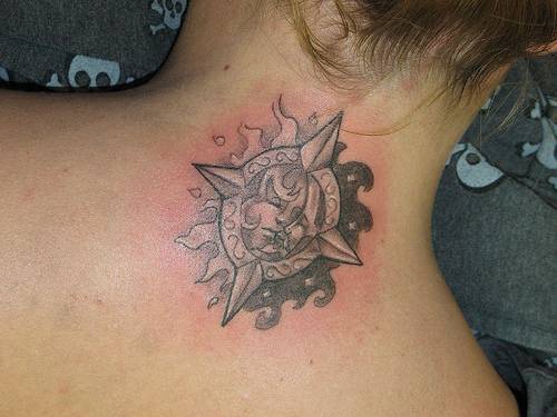Sun and moon symbol tattoo on back