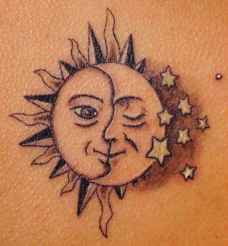 Humanized sun and moon tattoo