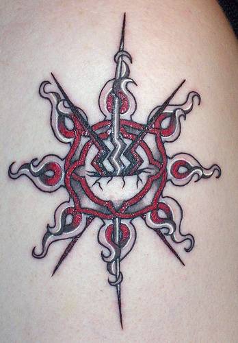 Black and red sun tattoo