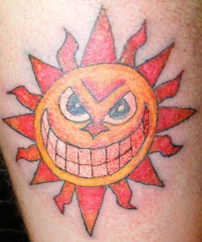 Smiling coloured sun tattoo