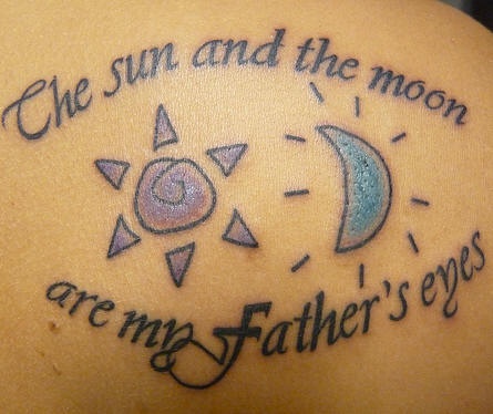 Sun and moon with writings  tattoo