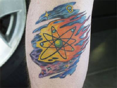 Atom structure in space coloured tattoo