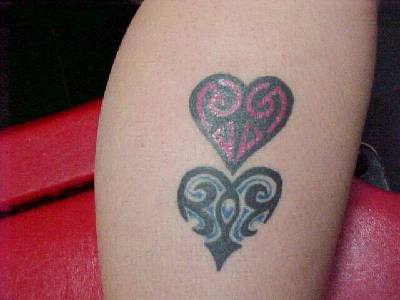 Blue and red hearts tattoo