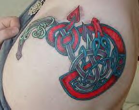 Red snake with tribal tracery tattoo