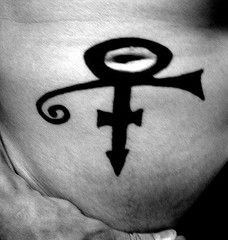 Tribal planet symbol tattoo