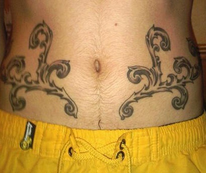 Stomach tattoo,  design symmetrical, curled branches
