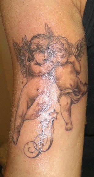 Two realistic cherubs black ink tattoo